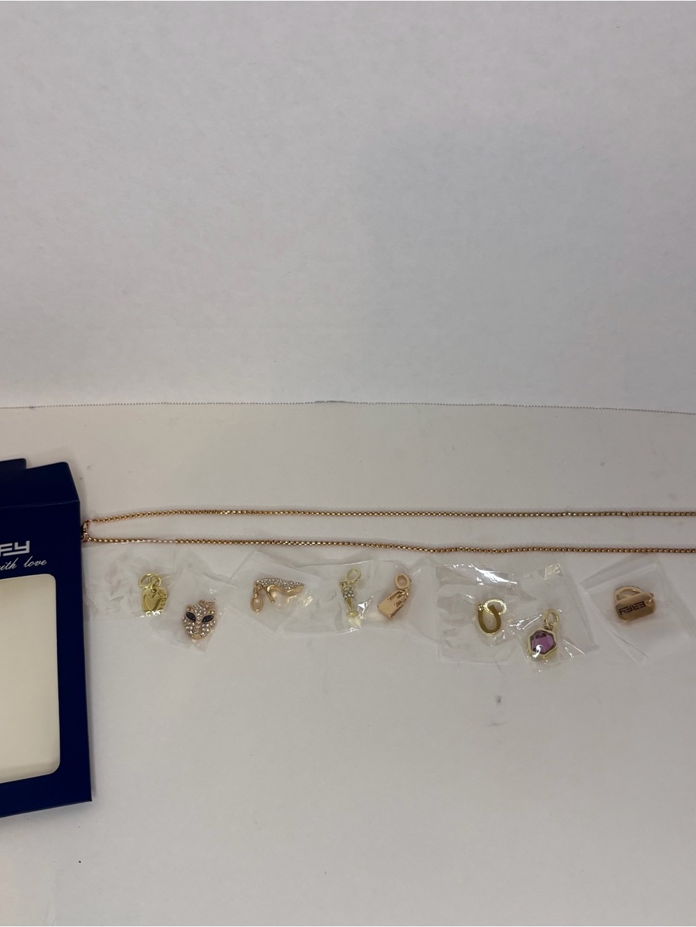 Gold Tone Charm Necklace Set